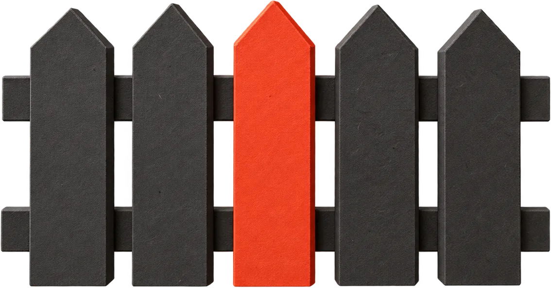 A row of black paper fence pickets with one red picket in the middle